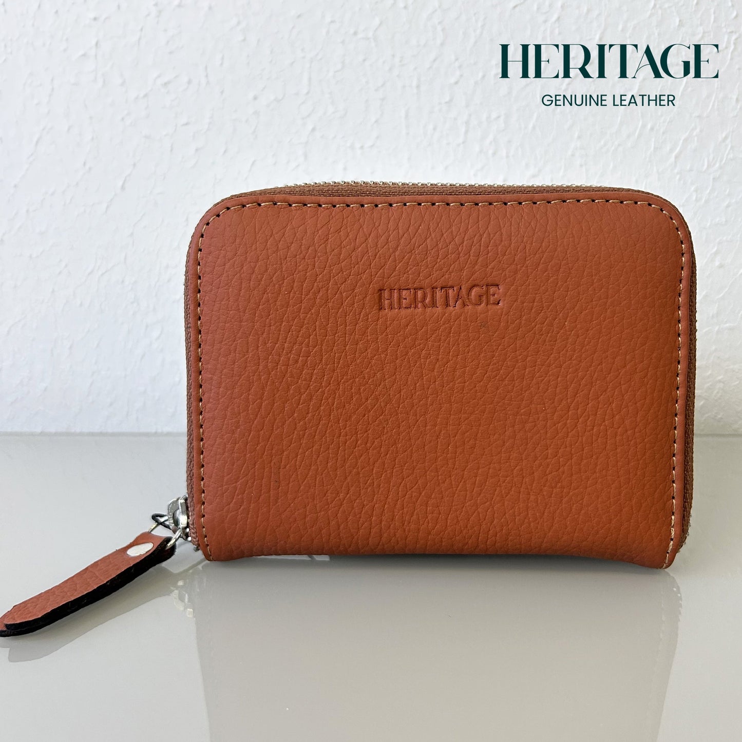 https://cdn.shopify.com/s/files/1/0847/9460/5873/files/Billetera_Pequena_con_Cierre_en_Cuero_Granulado_NARANJA.jpg?v=1729002673